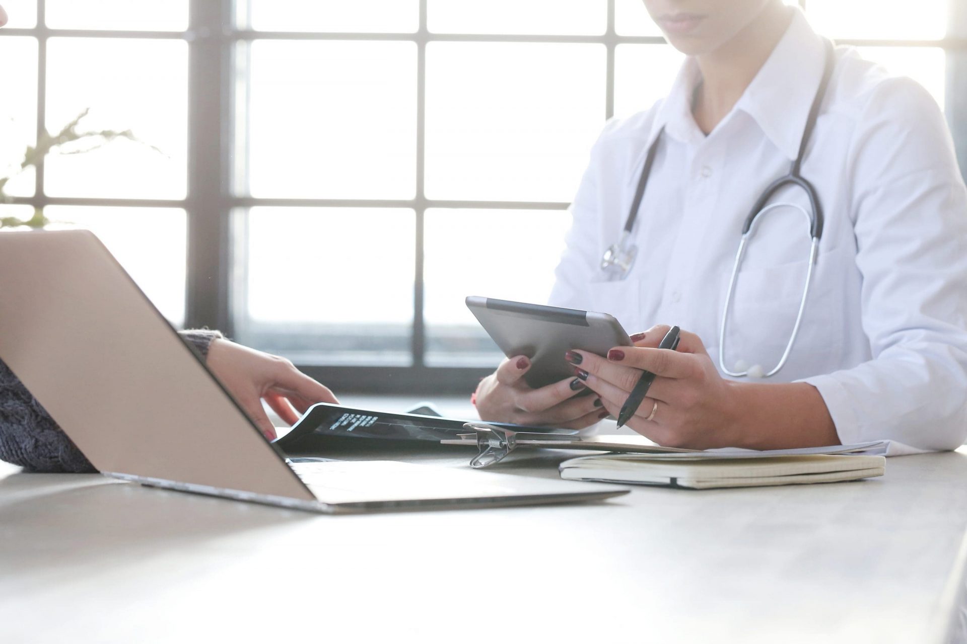 doctor using cell phone tablet